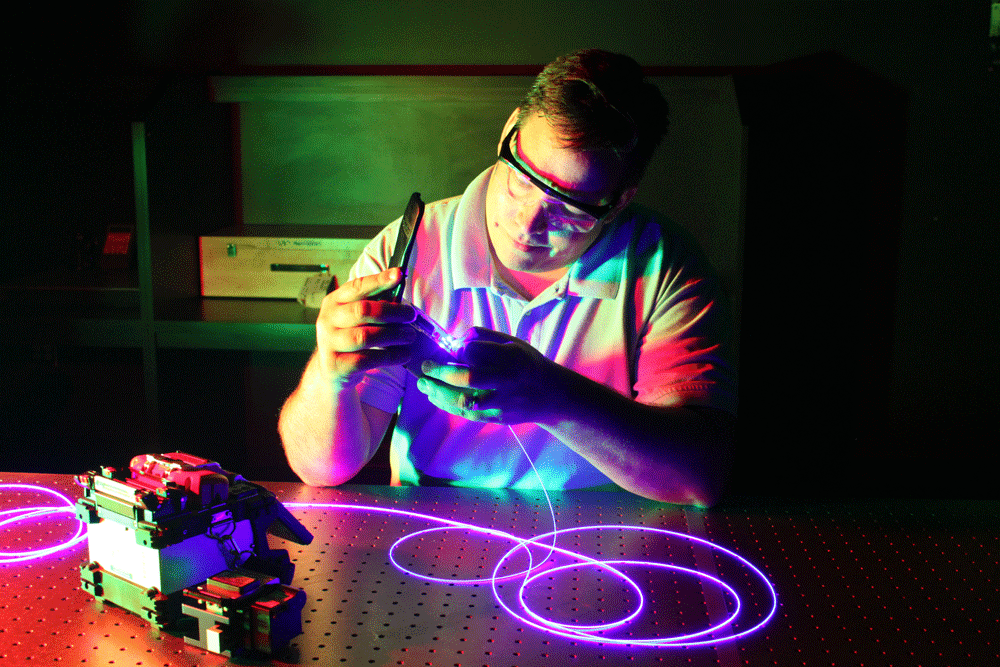 LASER-TEC student John Anderson terminates a single-mode fiber.