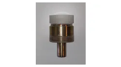 FIGURE 1. An aspheric lens is mounted on a brass arbor.
