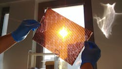 FIGURE 2. Shown is a photograph of the first A4 paper-sized semitransparent perovskite solar module prepared by Saule Technologies.