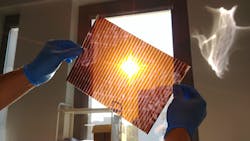 FIGURE 2. Shown is a photograph of the first A4 paper-sized semitransparent perovskite solar module prepared by Saule Technologies. FIGURE 2. Shown is a photograph of the first A4 paper-sized semitransparent perovskite solar module prepared by Saule Technologies.