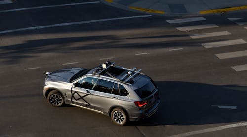 FIGURE 1. Four Blackmore lidar sensors are mounted atop a BMW X5 test vehicle on the road.
