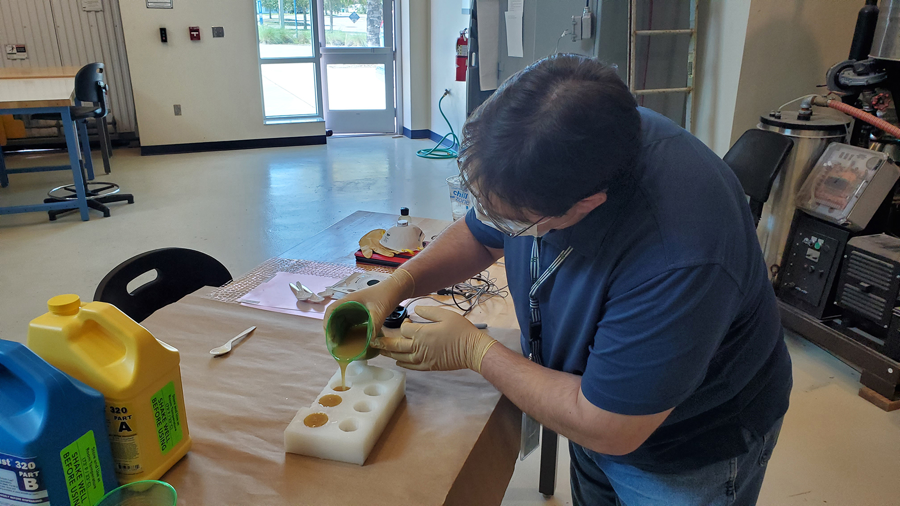 John Anderson, LASER-TEC technologist, manufactures laser stands using resin and rubber-silicon casting. The stands will be part of the Light and Optics Experiment Kits (LOEKs) manufactured by the LASER-TEC Center housed at Indian River State College. The kits provide every student in The Optics and Photonics College Network (OPCN) nationwide with a kit allowing them to conduct experiments required to complete their laboratories from the safety of their homes during the COVID-19 pandemic. The LASER-TEC Center has sent 116 kits to students at 11 colleges across the country.