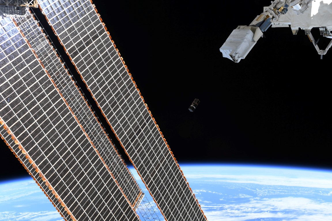 An image of SpooQy-1 was taken as the nanosatellite was deployed from the International Space Station (the satellite is barely visible near the center of the image).