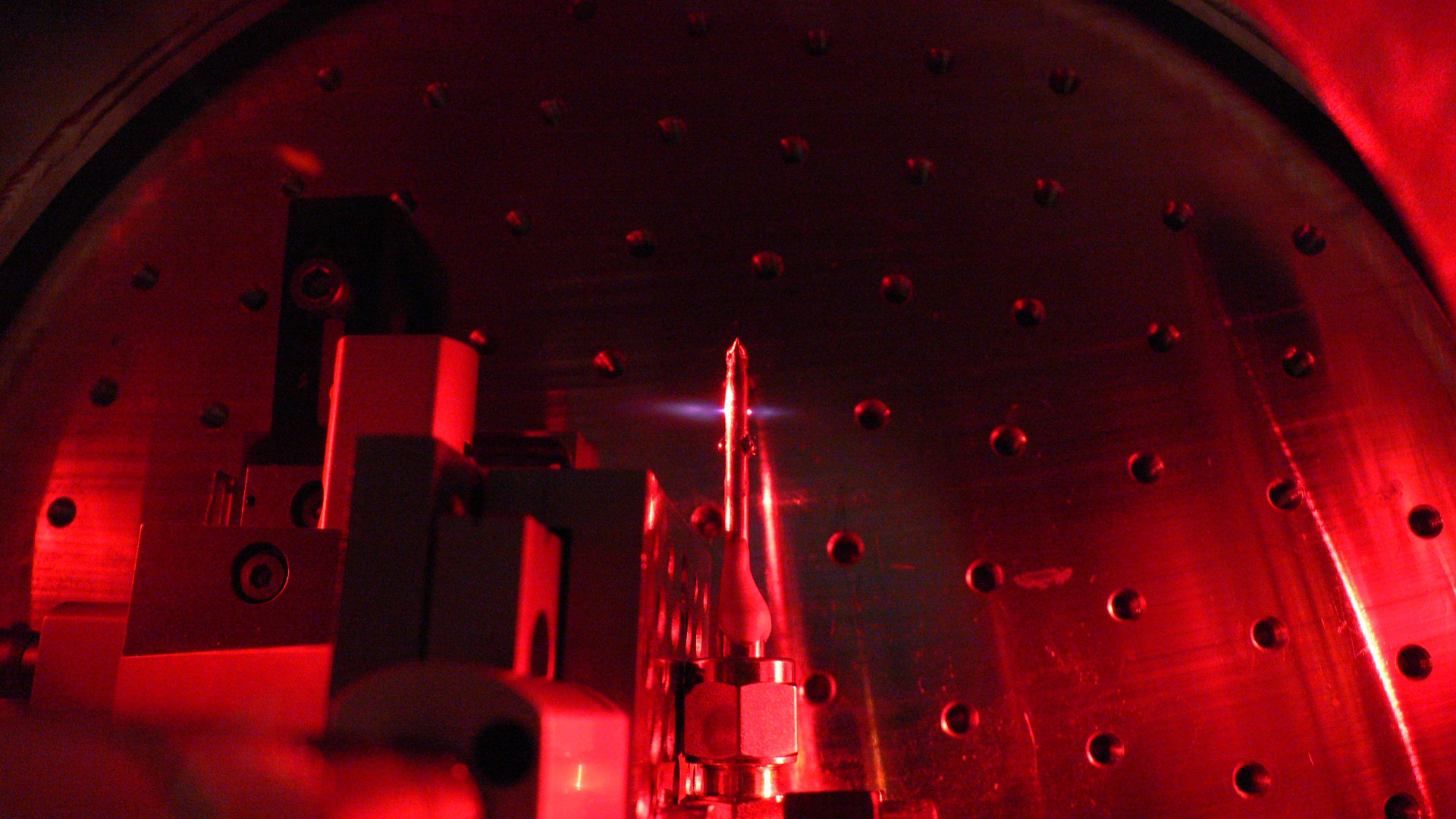 In a vacuum chamber, a quasi-static gas cell filled with neon triples the frequency of a broadband ultrafast IR-laser pulse.