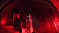 In a vacuum chamber, a quasi-static gas cell filled with neon triples the frequency of a broadband ultrafast IR-laser pulse. In a vacuum chamber, a quasi-static gas cell filled with neon triples the frequency of a broadband ultrafast IR-laser pulse.