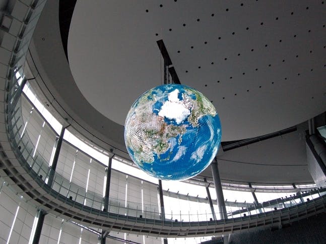 FIGURE 2. A spherical OLED display containing 10 million pixels hangs in Japan&rsquo;s National Museum of Emerging Science and Innovation (top). Its foundation is an aluminum sphere divided into eight quadrants.