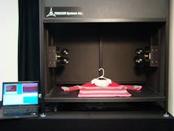 FIGURE 3. A Tricor Systems imaging spectrophotometer quantitatively analyzes the colors in an item of clothing. FIGURE 3. A Tricor Systems imaging spectrophotometer quantitatively analyzes the colors in an item of clothing.