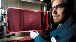 FIGURE 1. Interferometry tests are performed on an LG760 laser glass slab to inspect quality of the glass finish. SCHOTT produces this potassium-barium-aluminum-phosphate-based glass in Duryea, PA. FIGURE 1. Interferometry tests are performed on an LG760 laser glass slab to inspect quality of the glass finish. SCHOTT produces this potassium-barium-aluminum-phosphate-based glass in Duryea, PA.
