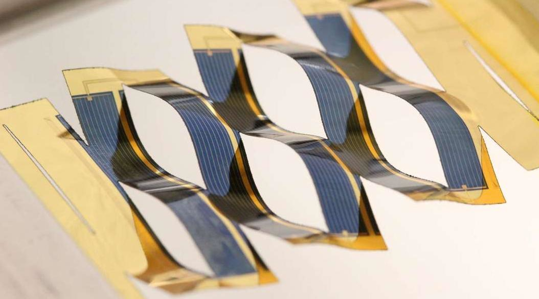 Cuts in a flexible backing for thin-film photovoltaic cells allow a flat solar panel to separate into many small cells that can track the sun across the sky. Tracking provides a 20% to 40% improvement in the amount of energy captured by the cells.