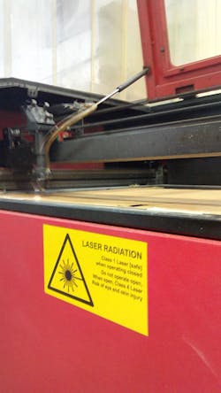 FIGURE 4. A laser-safety label details the specific setup of the laser to which it is affixed: a class I (safe) laser when closed, but a class 4 (high-power, unsafe) laser when open. FIGURE 4. A laser-safety label details the specific setup of the laser to which it is affixed: a class I (safe) laser when closed, but a class 4 (high-power, unsafe) laser when open.