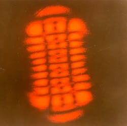 FIGURE 1. The first red helium-neon laser generated striking patterns of high-order modes at Bell Labs. FIGURE 1. The first red helium-neon laser generated striking patterns of high-order modes at Bell Labs.