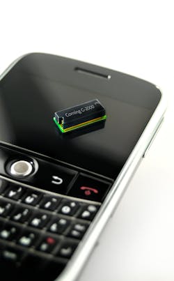 FIGURE 1. Corning&apos;s green laser module for a pico-projector is 4 mm thick and shown sitting on a smart phone for scale.