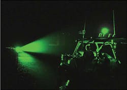 FIGURE 3. Nonlethal laser illuminates a maritime target during an operational field test in July 2009 at the Kennedy Space Center, conducted by the Naval Medical Research Unit (San Antonio, TX). FIGURE 3. Nonlethal laser illuminates a maritime target during an operational field test in July 2009 at the Kennedy Space Center, conducted by the Naval Medical Research Unit (San Antonio, TX).