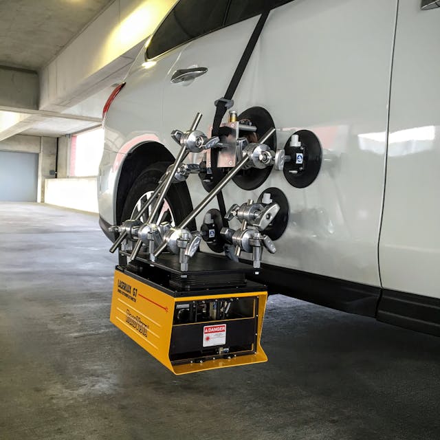 The RoadVista LLG7 laser-scanning road measurement instrument is mounted on a car using vacuum-cup mounting technology originally developed for the motion picture industry.