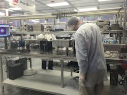 FIGURE 2. A CO2 laser for generating extreme ultraviolet (EUV) light undergoes rigorous testing in a modern manufacturing facility. FIGURE 2. A CO2 laser for generating extreme ultraviolet (EUV) light undergoes rigorous testing in a modern manufacturing facility.