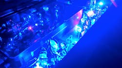FIGURE 1. In this fully diode-pumped ultrafast Ti:sapphire oscillator-amplifier system, the Kerr-lens-modelocked Ti:sapphire oscillator is pumped with a single-emitter 465 nm diode (3.1 W), while the amplifier is pumped by either high-power fiber-coupled 450 nm diodes (up to 100 W), or spatially/spectrally combined 465/450 nm single emitters (up to 30 W), and is cryogenically cooled. FIGURE 1. In this fully diode-pumped ultrafast Ti:sapphire oscillator-amplifier system, the Kerr-lens-modelocked Ti:sapphire oscillator is pumped with a single-emitter 465 nm diode (3.1 W), while the amplifier is pumped by either high-power fiber-coupled 450 nm diodes (up to 100 W), or spatially/spectrally combined 465/450 nm single emitters (up to 30 W), and is cryogenically cooled.