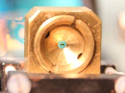 FIGURE 2. A photograph shows the sample holder with the diamond-membrane sandwich. FIGURE 2. A photograph shows the sample holder with the diamond-membrane sandwich.