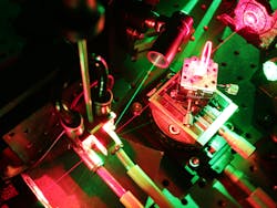 FIGURE 4. The membrane laser is shown in operation. A birefringent filter is used for wavelength tuning.
