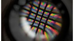 FIGURE 1. An 8 × 8 array bandpass filter is viewed through a magnifier. FIGURE 1. An 8 × 8 array bandpass filter is viewed through a magnifier.