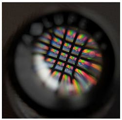 FIGURE 1. An 8 × 8 array bandpass filter is viewed through a magnifier. FIGURE 1. An 8 × 8 array bandpass filter is viewed through a magnifier.