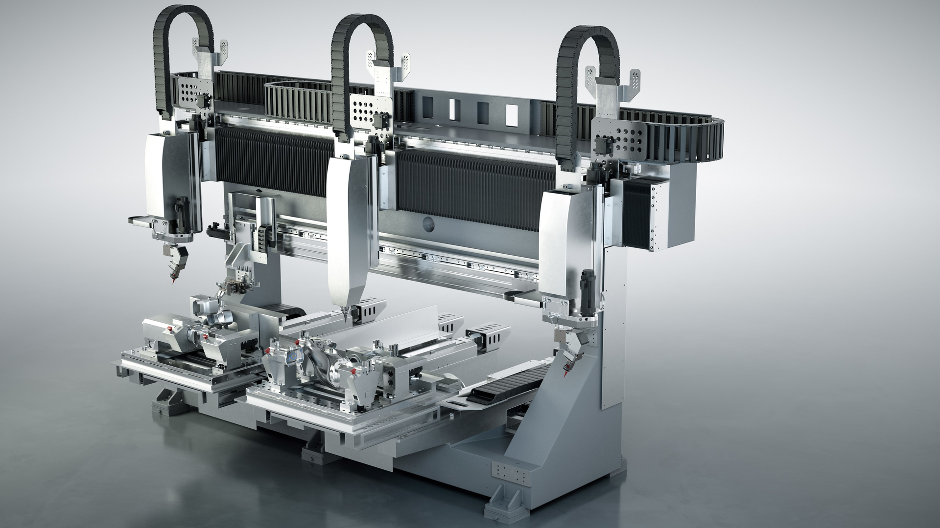 FIGURE 1. The FLC (Flexible Laser Cell) Machine with one head for cutting and two heads for welding is shown.