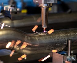 FIGURE 2. The FLC machine cuts a sensor boss hole in a pipe. FIGURE 2. The FLC machine cuts a sensor boss hole in a pipe.