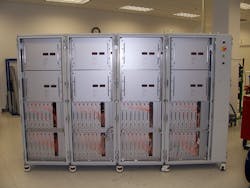 FIGURE 3. This multimode fiber laser built by IPG delivers 50 kW through up to more than 25 m of 200-µm-core fiber. Drawing 170 kW of electrical power, it has wall-plug efficiency of 30% and weighs 3000 kg. FIGURE 3. This multimode fiber laser built by IPG delivers 50 kW through up to more than 25 m of 200-µm-core fiber. Drawing 170 kW of electrical power, it has wall-plug efficiency of 30% and weighs 3000 kg.