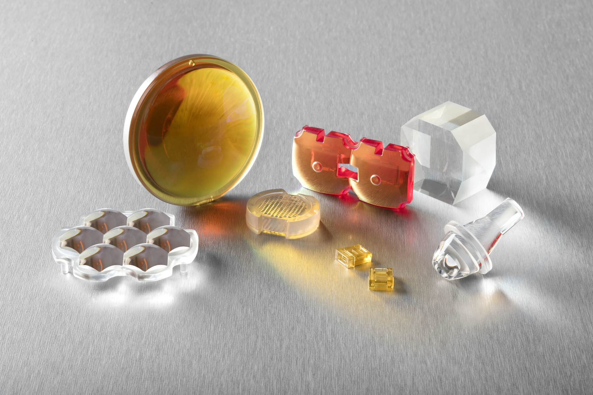 FIGURE 1. Polymer optics come in a wide variety of configurations and materials; many applications of polymer optics call for the use of optical coatings.