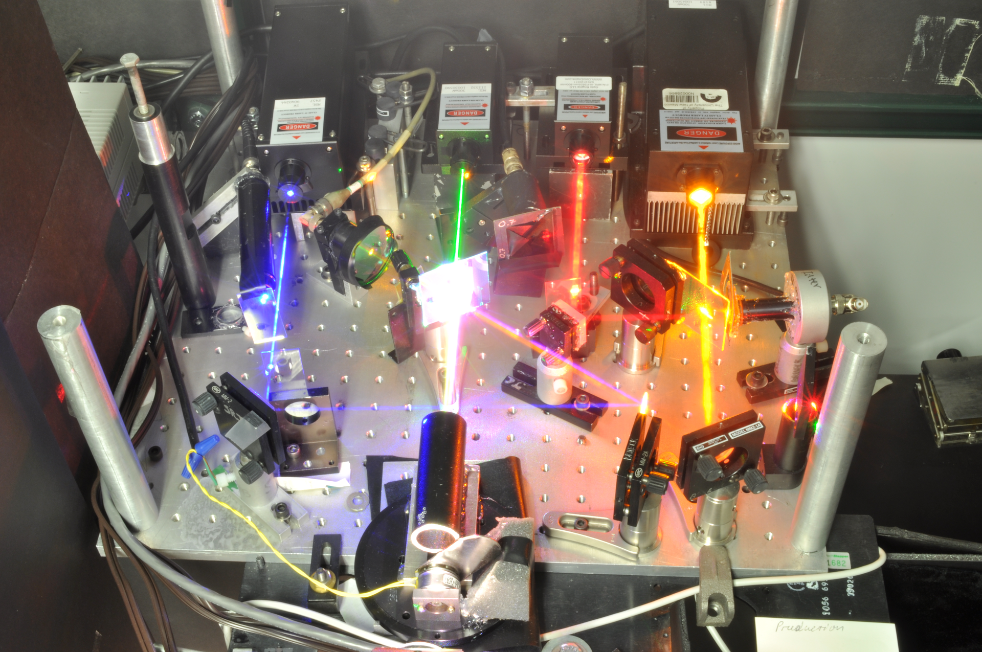 A four-color laser illuminator produces white light with a quality as high as that of conventional white-light sources.