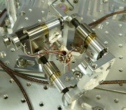 FIGURE 1. New Focus UHV Picomotor actuators are used in the Laser Interferometer Gravitational Wave Observatory (LIGO) as part of the Transmission Monitor Suspended Optical Bench. This platform will monitor the light transmitted through the End Test Mass. The actuators will enable control of precision alignment from outside one of the world's largest vacuum systems. FIGURE 1. New Focus UHV Picomotor actuators are used in the Laser Interferometer Gravitational Wave Observatory (LIGO) as part of the Transmission Monitor Suspended Optical Bench. This platform will monitor the light transmitted through the End Test Mass. The actuators will enable control of precision alignment from outside one of the world's largest vacuum systems.