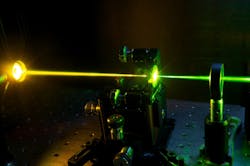 FIGURE 2. A monolithic diamond Raman laser at the University of Strathclyde converts green to yellow light.