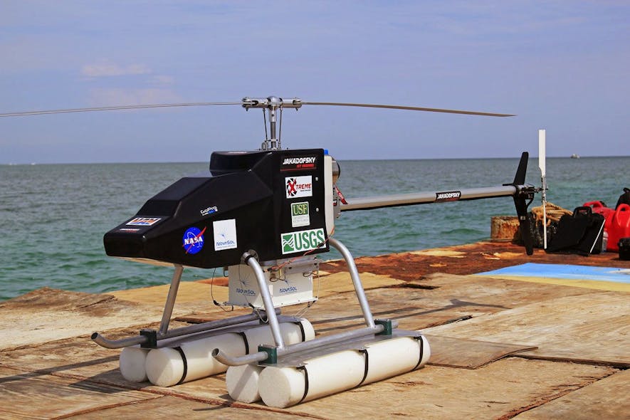 FIGURE 2. VisionII UAV with SHARK system, including the monolithic visNIR HSI sensor, flies from a deployment barge to conduct studies of Florida coastal waters.