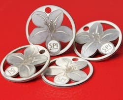 FIGURE 3. Pulsed nanosecond fiber lasers are now commonplace in the jewelry industry for producing fine metal cutting and texturing, such as for this silver lily design. FIGURE 3. Pulsed nanosecond fiber lasers are now commonplace in the jewelry industry for producing fine metal cutting and texturing, such as for this silver lily design.