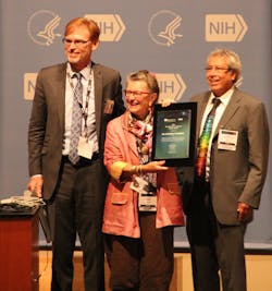 Bruce Tromberg (left) and Amir Gandjbakhche (right) presented Katarina Svanberg of Lund University (Sweden) with the 2015 NIH Bench-to-Bedside Pioneer Award. Bruce Tromberg (left) and Amir Gandjbakhche (right) presented Katarina Svanberg of Lund University (Sweden) with the 2015 NIH Bench-to-Bedside Pioneer Award.