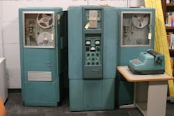 FIGURE 1. Bendix G15 was an early vacuum tube computer with 450 vacuum tubes and 300 germanium diodes. The main unit is in the middle; tape drives are to the sides. Control was through the digital typewriter at right. FIGURE 1. Bendix G15 was an early vacuum tube computer with 450 vacuum tubes and 300 germanium diodes. The main unit is in the middle; tape drives are to the sides. Control was through the digital typewriter at right.