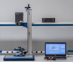 FIGURE 2. A typical tabletop setup is shown for a UM-1 laser system. All components related to the marking process are enclosed in the marker head (left), leaving a single regular cable connection from the power supply (right). The lack of a typical controller/marker head setup saves space while optimizing modularity for integration. FIGURE 2. A typical tabletop setup is shown for a UM-1 laser system. All components related to the marking process are enclosed in the marker head (left), leaving a single regular cable connection from the power supply (right). The lack of a typical controller/marker head setup saves space while optimizing modularity for integration.
