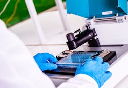 FIGURE 2. Applied to a 96-well microtiter plate, the optical technology enables high-throughput bioanalytical research. Because the entire microscope system measures just 45 &times; 26 &times; 25 cm (about 18 &times; 10 &times; 10 in.), it can operate in the field as well as in standard laboratory incubators (temperature: 20-40&deg;C, humidity: 20-93%).