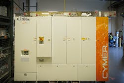 FIGURE 2. Cymer XLR 960ix has introduced a new optical pulse stretcher (OPuS) shown here on top of the laser. FIGURE 2. Cymer XLR 960ix has introduced a new optical pulse stretcher (OPuS) shown here on top of the laser.