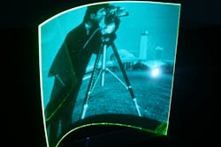 A thin-film luminescent concentrator (LC) creates a flexible, fully transparent, scalable, and low-cost polymer image sensor. The approach reconstructs grayscale images focused onto the LC surface. Here, an image is projected onto a Bayer Makrofol LISA Green LC film, which absorbs blue and re-emits green light. A thin-film luminescent concentrator (LC) creates a flexible, fully transparent, scalable, and low-cost polymer image sensor. The approach reconstructs grayscale images focused onto the LC surface. Here, an image is projected onto a Bayer Makrofol LISA Green LC film, which absorbs blue and re-emits green light.