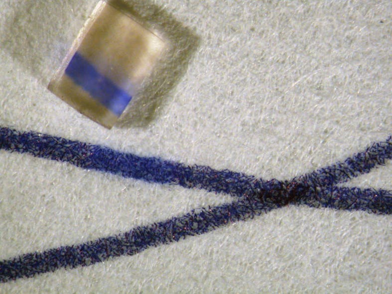 FIGURE 2. In order to facilitate Raman spectroscopic identification of a dye embedded in a textile, special chemicals are used to lift a small percentage of dye onto a hydrogel cube without harmfully affecting the sample. The dye is then dissolved in a solution of metal nanoparticles for Raman detection.