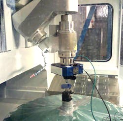 FIGURE 2. An optical profiler mounted inside a polishing station allows quick measurement between passes of the polishing process.