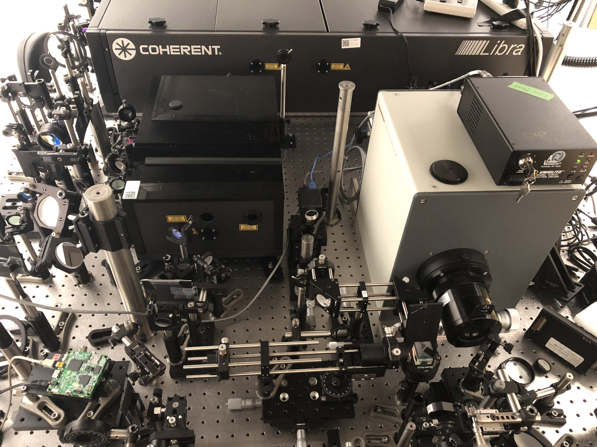 Key components in the 10 trillion frames/s T-CUP system include a charge-coupled device (CCD) camera that performs spatiotemporal integration, and a digital micromirror device (DMD) for spatial encoding.