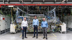 Standing in front of the world&apos;s strongest pulsed industrial laser are (L-R) Dr. Peter K&uuml;rz from ZEISS Semiconductor Manufacturing Technology (SMT); Michael K&ouml;sters from TRUMPF Lasersystems for Semiconductor Manufacturing; and Sergiy Yulin from Fraunhofer IOF. (Copyright: Deutscher Zukunftspreis/Ansgar Pudenz)