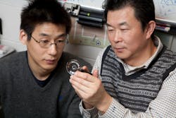 FIGURE 1. Allen Yi and Lei Li inspect a prototype lens that can be used to create three-dimensional images. FIGURE 1. Allen Yi and Lei Li inspect a prototype lens that can be used to create three-dimensional images.