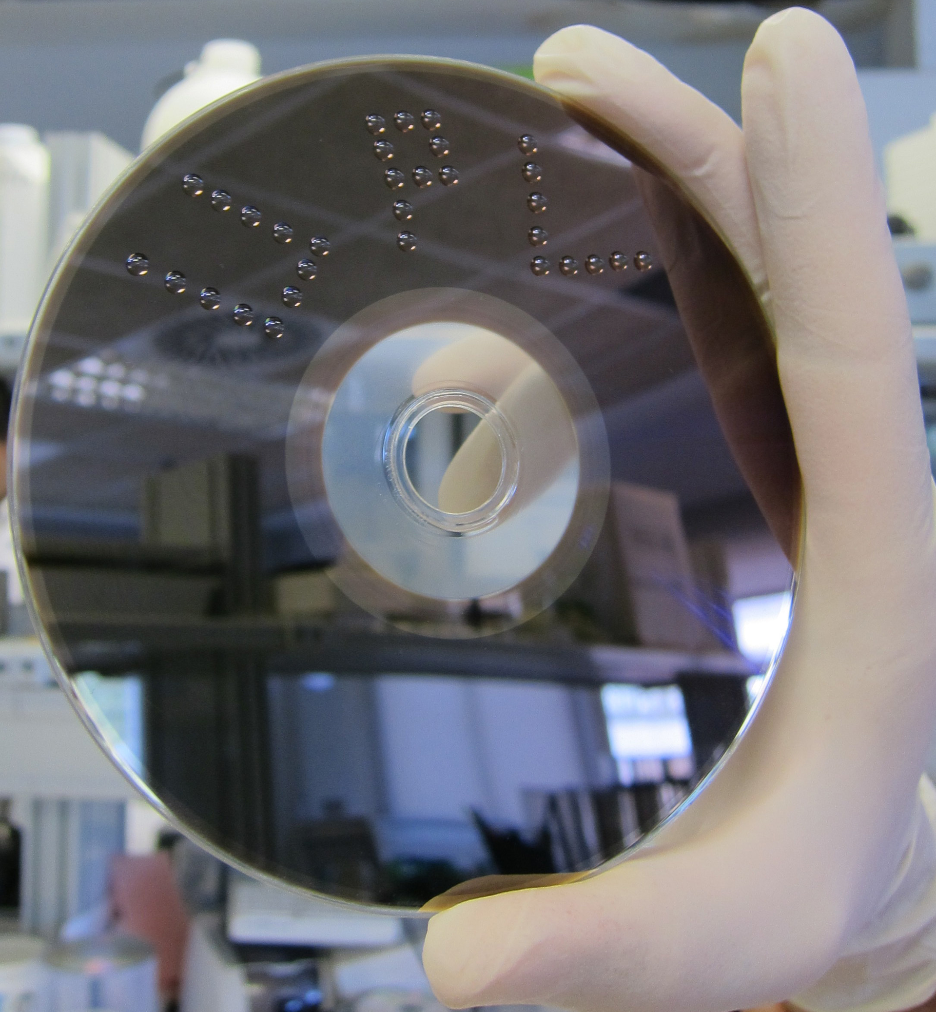 The surface of a Blu-ray disc is hydrophobic, allowing proteins to be locked in place by passive adsorption in a high-density format (64 points in each 1 mm2 drop).