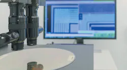 FIGURE 1. Silicon wafer undergoing inspection.