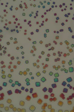 Assemblies of colloidal nanocrystals—called superlattices—are shown under white-light illumination; the superlattice structures are composed of 3D cubic-shaped collections of quantum dots with similar physical sizes and optoelectronic emission properties. Assemblies of colloidal nanocrystals—called superlattices—are shown under white-light illumination; the superlattice structures are composed of 3D cubic-shaped collections of quantum dots with similar physical sizes and optoelectronic emission properties.