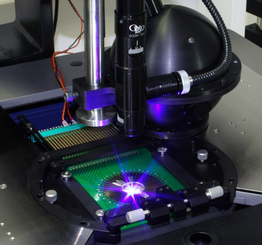 FIGURE 1. Devices are tested on a prober using an integrating sphere to assess performance characteristics during the sorting process known as binning.