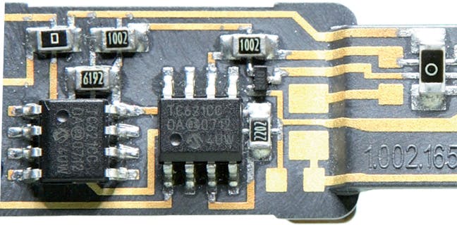 FIGURE 3. An LDS-fabricated circuit board used within a dental instrument shows the unique integration of the molded plastic component with electrical traces and surface-mount components (inset).
