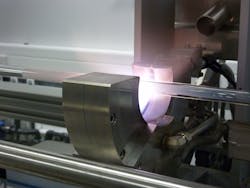 FIGURE 1. Modified chemical-vapor deposition (MCVD) equipment for preform fabrication shows the deposition of a porous silica soot layer. FIGURE 1. Modified chemical-vapor deposition (MCVD) equipment for preform fabrication shows the deposition of a porous silica soot layer.